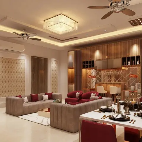 Open-plan living, dining and bar area with a taupe channel-tufted sectional sofa and burgundy accent chairs, a wood-slat home bar with wine storage