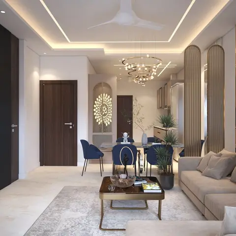 Open-plan living-dining space with a marble TV feature wall, a ring chandelier over navy dining chairs, and a glimpse of the kitchen beyond.