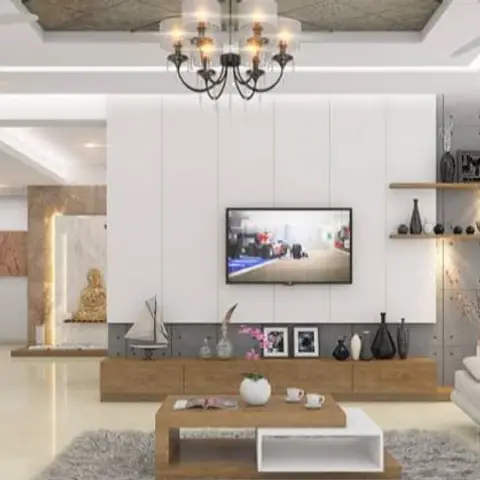 Open-plan living space with a black candelabra-style chandelier over a wood TV console, stone-clad feature wall, and a grey sofa with fluffy rug