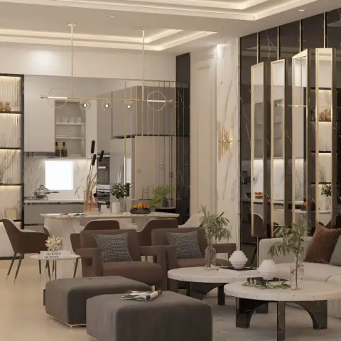 Open-plan living space with a brown velvet sofa and armchairs around round marble coffee tables, a gold ring pendant light, marble-clad walls