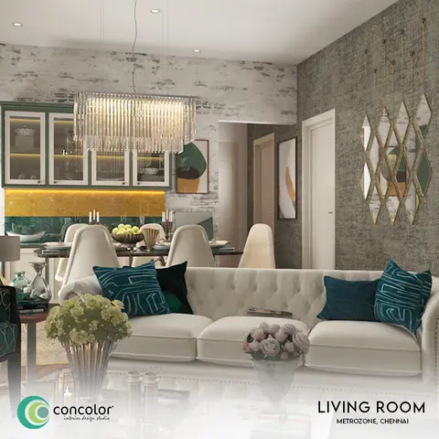 Open-plan living space with a white tufted sofa dressed in teal patterned cushions, a crystal box chandelier over the dining table
