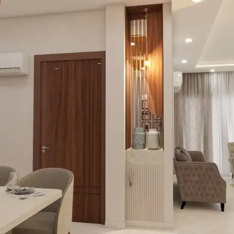 Open-plan render showing a fluted-panel display niche dividing a dining table from a tufted-armchair living seating area under sheer curtains.