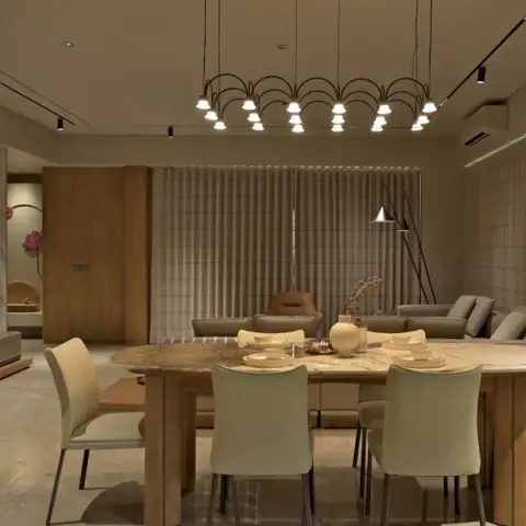 Oval stone-top dining table with cream leather chairs under a long arched multi-lamp linear pendant