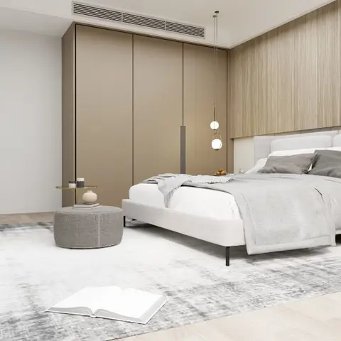 Pale grey upholstered bed against a full-height oak-fluted headboard wall, beside a flush beige wardrobe run