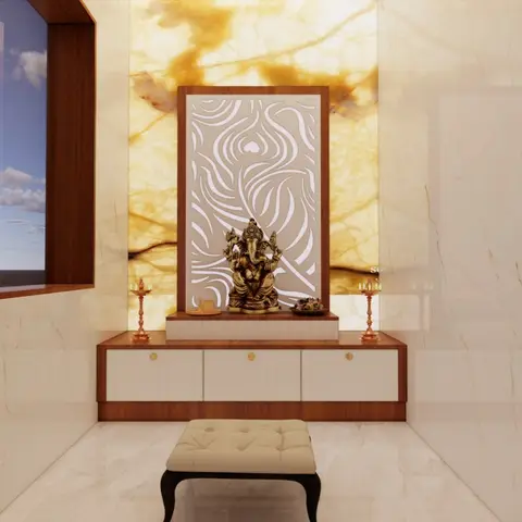 Pooja alcove with a backlit amber onyx feature wall, a carved jaali panel behind a brass Ganesha idol, and a floating wood-and-white console below.