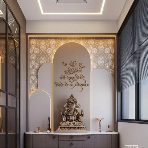 Pooja niche with a backlit arched alcove, a floral-motif wall pattern, a Ganesh idol, and a wood console with drawers for pooja accessories.