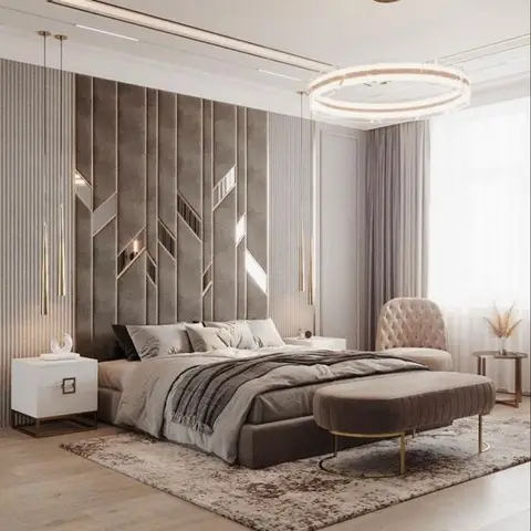 Primary bedroom render with a mirrored chevron upholstered headboard wall, a circular gold-ring chandelier