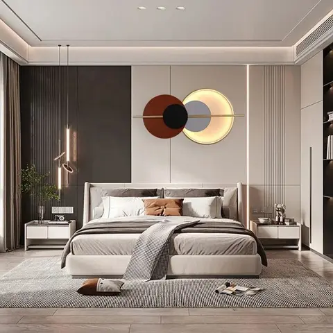 Primary bedroom render with an upholstered bed facing a backlit circular sculptural art piece as the headboard-wall focal point