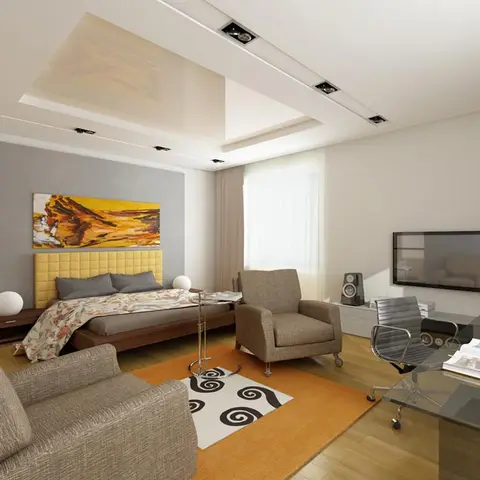 Render of a bedroom-cum-study: a yellow tufted headboard against a grey painted panel, an orange rug with black swirl motifs