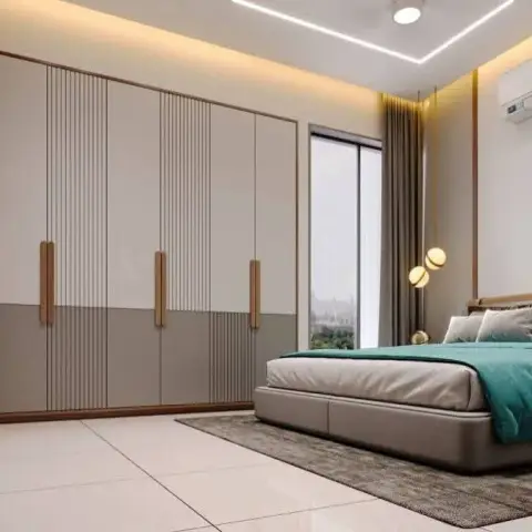 Render of a bedroom where a two-tone beige-and-grey wardrobe run with part-fluted shutters and full-height timber pulls faces a grey upholstered bed dressed