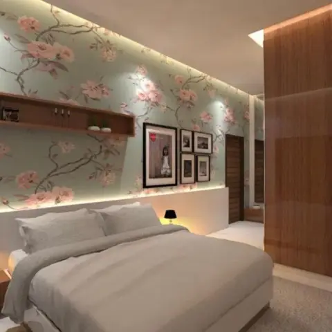Render of a bedroom whose mint floral wallpaper wall is washed by a concealed cove