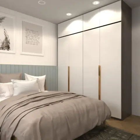 Render of a bedroom with a sage tongue-and-groove dado behind a wood-framed bed, two botanical prints above it and a white floor-to-ceiling wardrobe with oak
