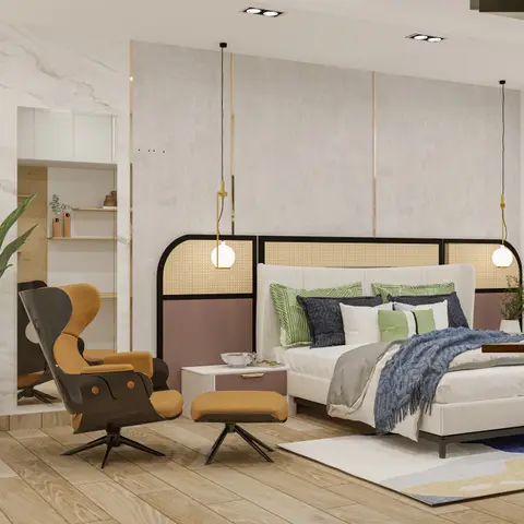 Render of a bedroom with a mid-century wingback lounge chair and ottoman beside a cane-and-color-blocked headboard wall