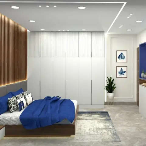 Render of a bedroom with a backlit fluted wood headboard wall and gold disc art, a white handleless wardrobe run down the long wall and a cobalt-backed TV