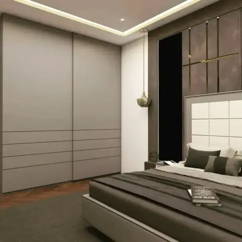 Render of a bedroom with a padded cream headboard against a textured bronze feature wall with a brass strip inlay, a grey sliding wardrobe