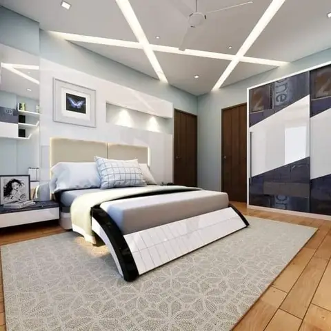 Render of a bedroom with a multi-angled cove-lit false ceiling, an LED-lit upholstered platform bed, and a denim-patterned sliding wardrobe.