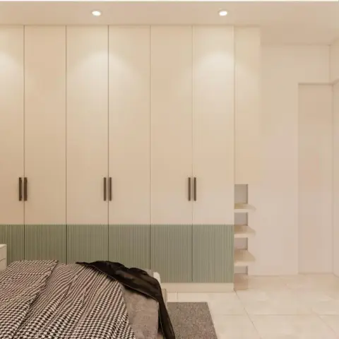 Render of a bedroom with a full-wall wardrobe in cream with sage-green fluted base panels, a fluted wood accent wall and a grey upholstered bed.
