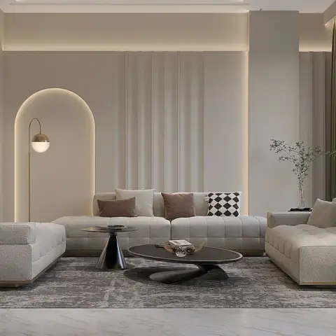 Render of a beige living room where three boucle biscuit-tufted sofas face a black oval coffee table on a faded grey rug