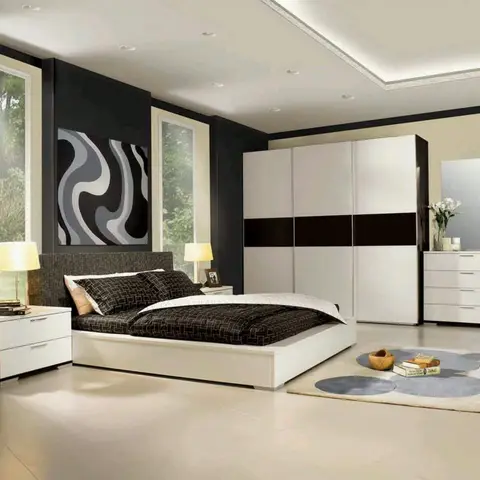 Render of a black-and-white bedroom with a sliding wardrobe, a bold abstract swirl artwork above the bed, and a polka-dot round area rug.