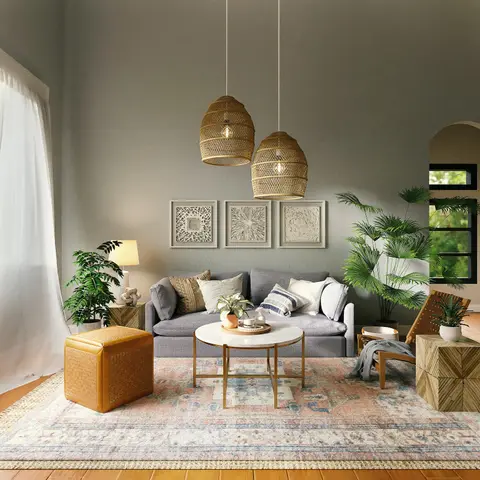 Render of a boho living room with woven rattan pendant lights, a grey sofa, a marble-top coffee table, and a patterned vintage-style area rug.