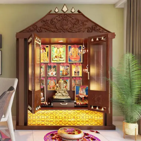 Render of a carved teak pooja mandir with a gopuram-style pediment and brass bell rows