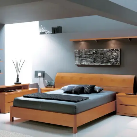 Render of a cherry-wood bedroom set - curved-back bed, matching bedside chests and a shaped full-height mirror stem with glass display shelves - against grey