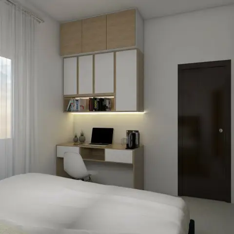 Render of a compact bedroom where a light-oak and white study desk with a laptop sits under a bookshelf of architecture titles and a loft of overhead cabinets