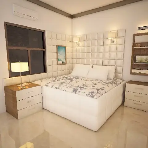 Render of a compact bedroom where a white grid-tufted upholstered panel runs the full headboard wall between two brass sconces