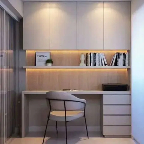 Render of a compact home study nook: a wall-hung cream desk with three-drawer pedestal, wood-veneer back panel