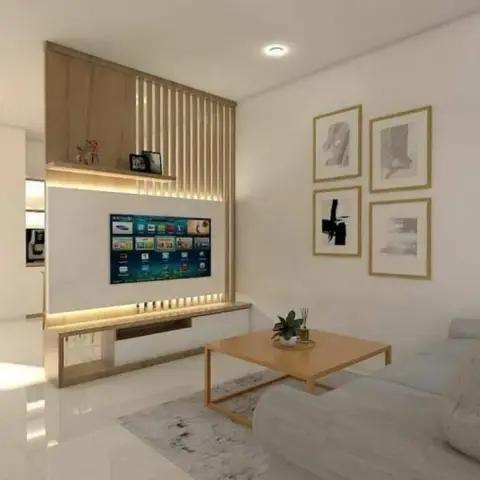 Render of a compact living room where a light-oak fluted batten screen rises over a backlit TV panel and floating console