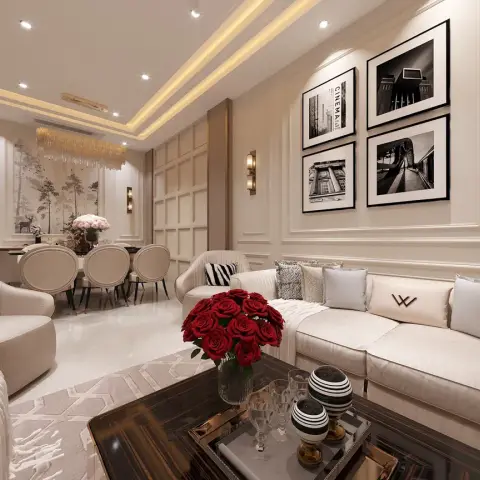 Render of a cream neo-classical living room with a grid-panelled wall, four black-and-white city photographs above a long ivory sofa and red roses on an ebony