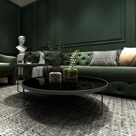 Render of a dark green living room with tufted velvet sofas, classic wall moulding panelling, a round glass coffee table styled with vases