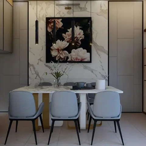Render of a dining nook with a marble-clad accent wall, three black cylindrical pendant lights over an oval table