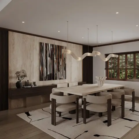 Render of a dining room where a travertine-clad wall carries a rippled bronze relief above a floating walnut buffet, with a travertine table