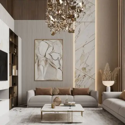 Render of a double-height living room with a cascading gold-leaf chandelier over a low cream sofa, a pale fluted panel wall carrying one large abstract canvas