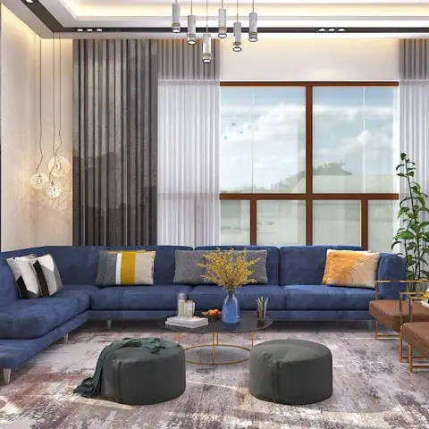 Render of a double-height living room with a navy blue L-shaped sectional, brass-framed brown accent chairs, a bubble-cluster pendant light
