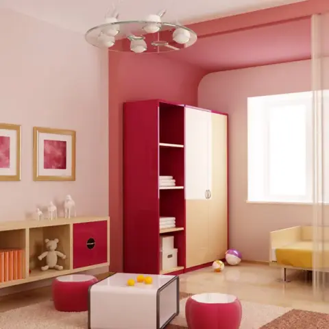 Render of a girl's room in two-tone pink with a crimson-and-cream wardrobe, a long low toy-storage run under three pink framed prints