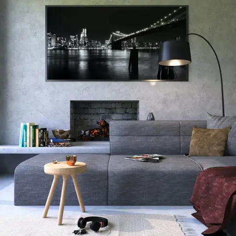 Render of a grey micro-concrete living room where an oversized black-and-white Brooklyn Bridge print hangs above a recessed brick firebox
