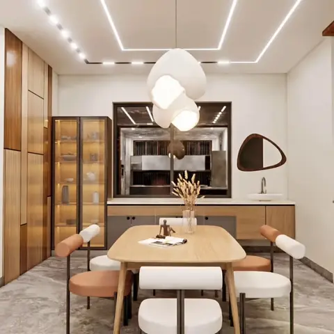Render of a light-oak dining area with a backlit glass-front display cabinet, a cluster pendant light, and a glimpse of a dark kitchen beyond.