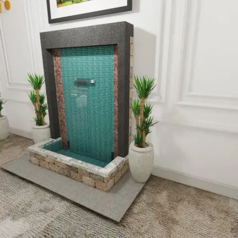 Render of a living room corner with an indoor wall-mounted water feature in teal glass mosaic tile framed by dark stone