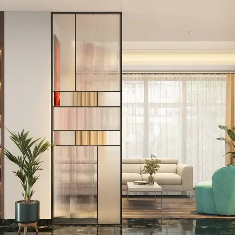 Render of a living room divided by a fluted reeded-glass and black metal partition from a display shelving nook, with a beige sofa