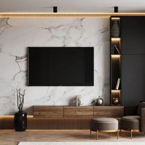 Render of a living-room TV wall in white veined marble, edged by greige fluted panelling with light washing down behind it