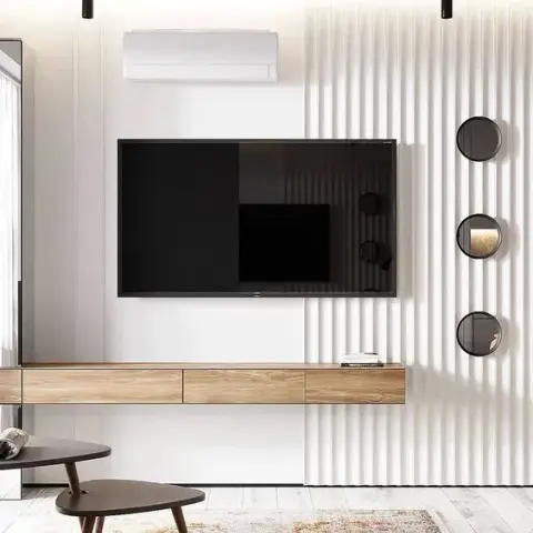 Render of a living room TV wall with white fluted panelling, a floating wood console, and three round mirror discs beside the screen.