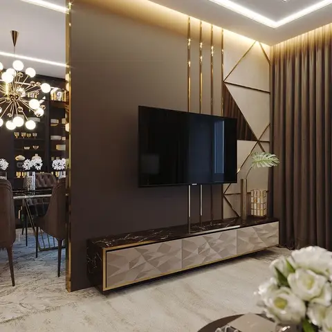 Render of a living room TV feature wall with a geometric gold-trimmed panel, a faceted-front marble-top console, and cove ceiling lighting