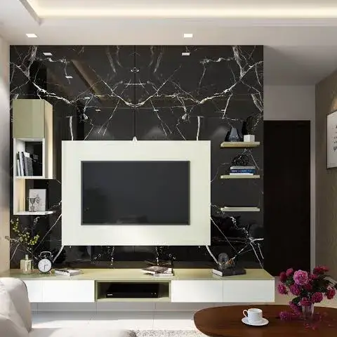 Render of a living room TV wall in black veined marble, framed by a cream open-shelf TV unit