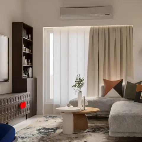 Render of a living room with a shaggy grey L-sectional, paired round coffee tables in stone and oak