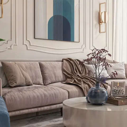 Render of a living room with a blush velvet sectional sofa and a blue accent armchair in front of a moulded panel wall hung with a blue arch-motif print