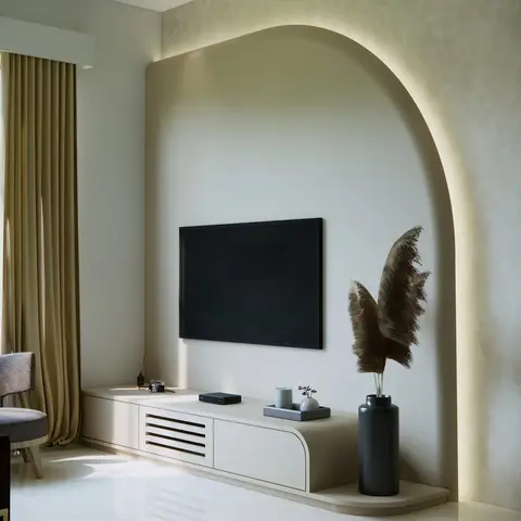 Render of a living room with a backlit arched niche wall in textured wallpaper framing a mounted TV, a curved cream TV console with fluted vent detail