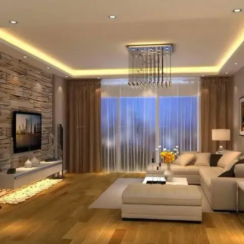 Render of a living room with a stacked-stone TV accent wall, a cove-lit ceiling, a crystal drop chandelier