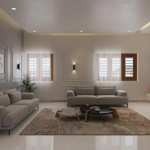 Render of a living room with two facing grey sofas around a black marble nested coffee table on brass legs, framed botanical prints on a moulded panel wall.